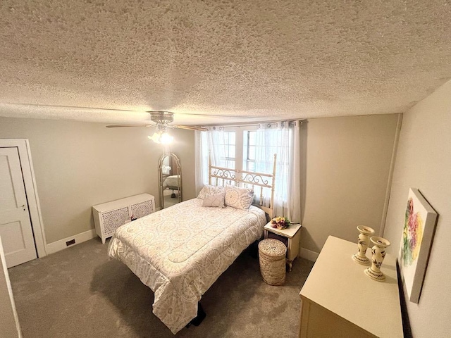 bedroom with carpet flooring, ceiling fan, a textured ceiling, and baseboards