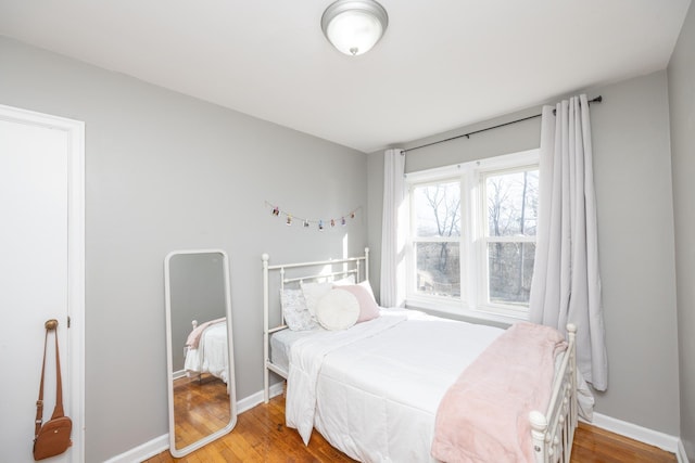 bedroom featuring wood-type flooring