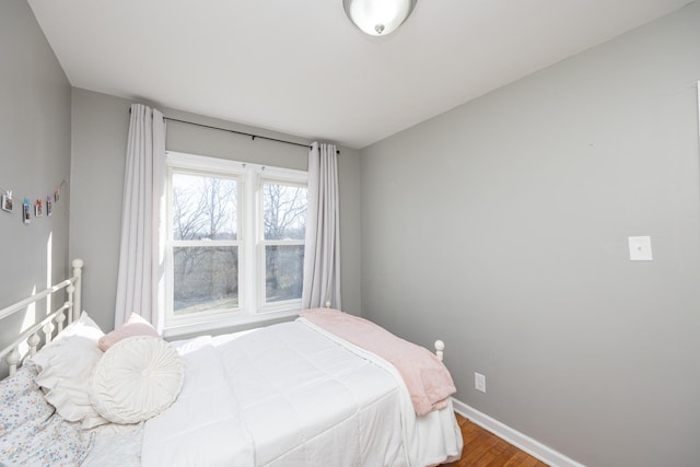 bedroom with hardwood / wood-style flooring