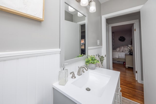 bathroom with vanity and hardwood / wood-style floors