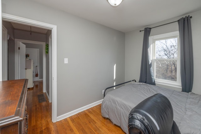 bedroom featuring hardwood / wood-style flooring