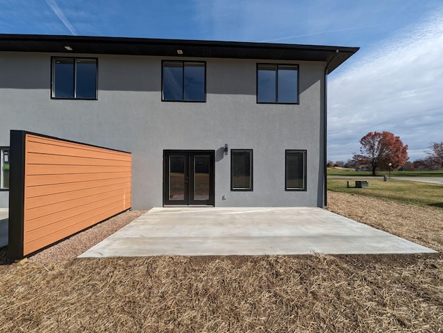 back of house with a patio