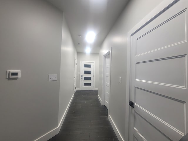 corridor with dark hardwood / wood-style floors