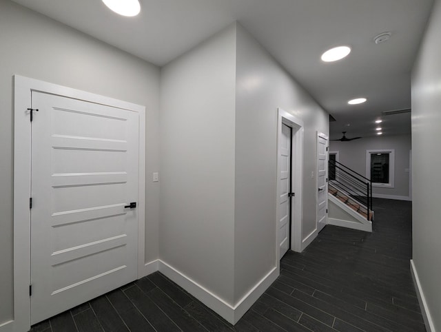 hall with dark hardwood / wood-style flooring