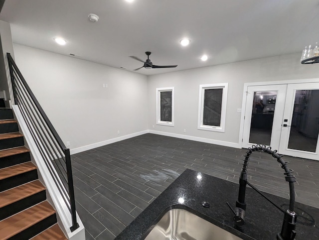 interior space featuring ceiling fan, dark hardwood / wood-style flooring, and french doors