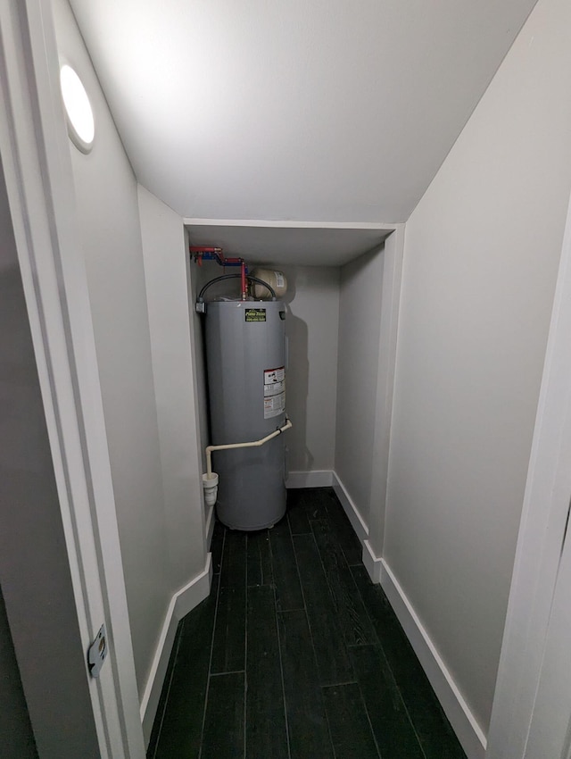 utility room featuring water heater