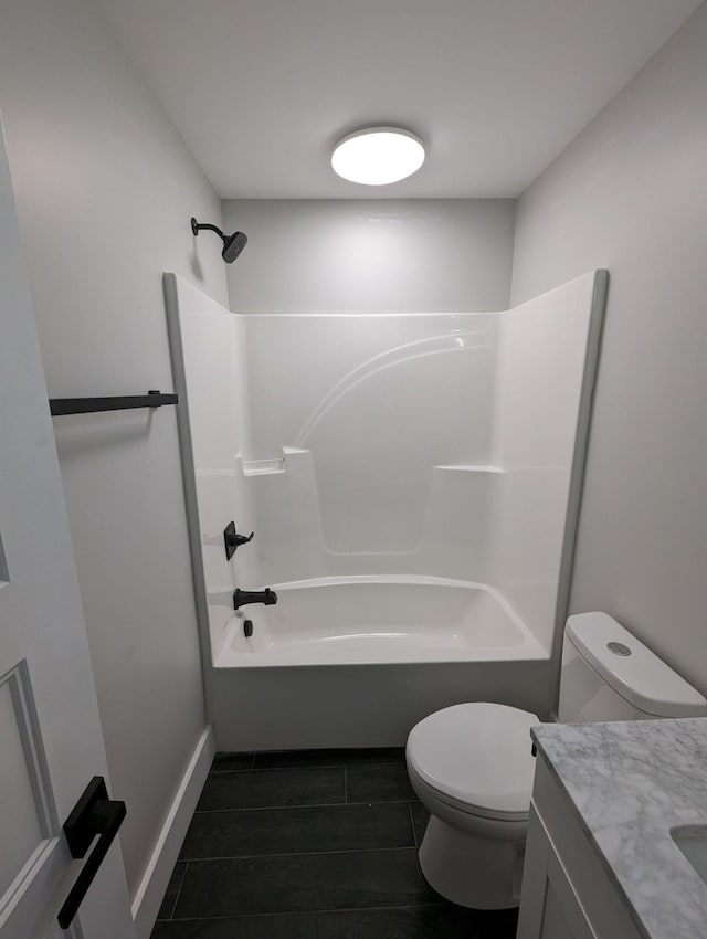 full bathroom featuring vanity,  shower combination, and toilet