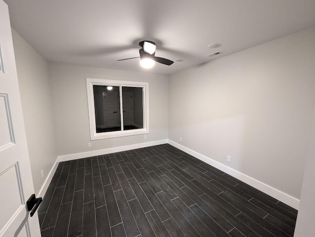 unfurnished room featuring dark hardwood / wood-style flooring and ceiling fan