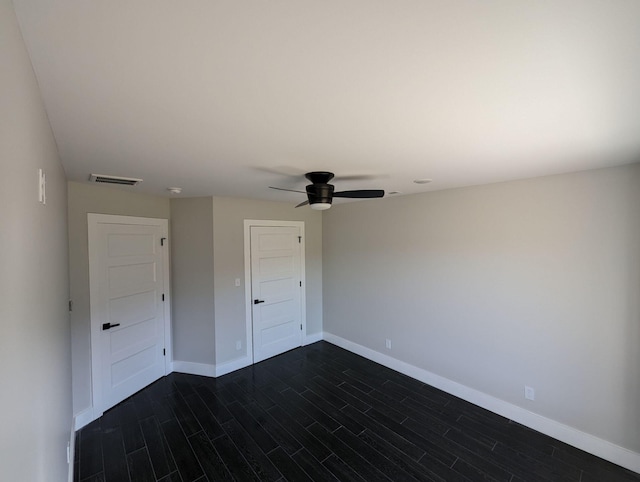 unfurnished bedroom with ceiling fan and dark hardwood / wood-style flooring