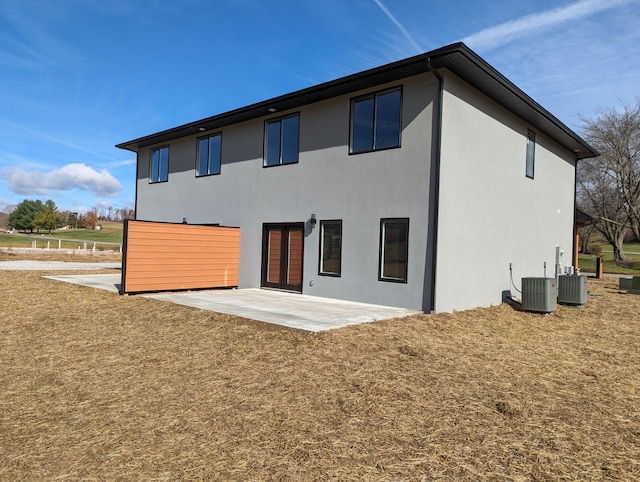 back of house featuring a patio and central air condition unit