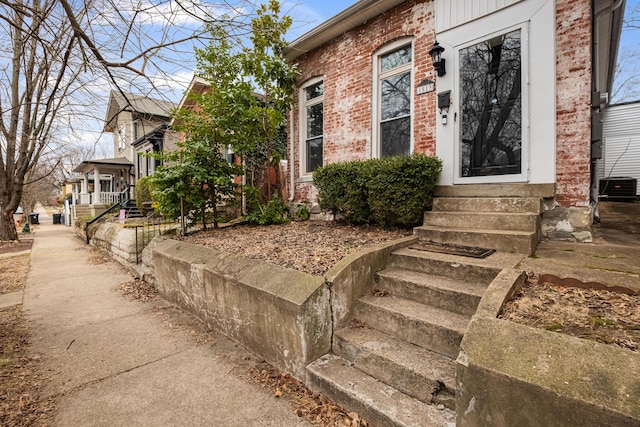 property entrance featuring central AC