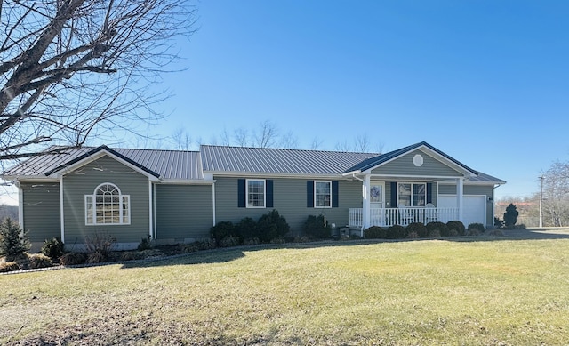 single story home featuring a garage, a front yard, and covered porch