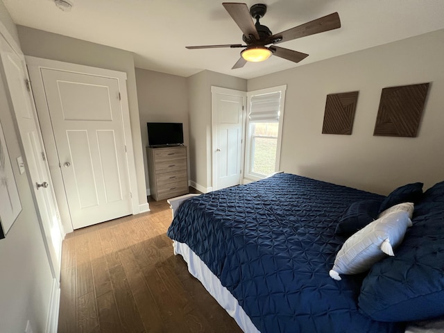 bedroom with hardwood / wood-style floors and ceiling fan