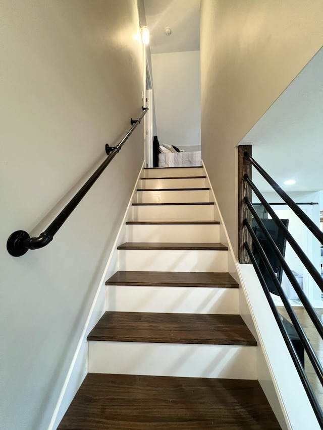 staircase featuring hardwood / wood-style flooring