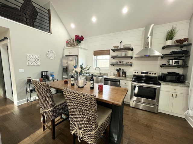 kitchen featuring sink, white cabinets, stainless steel appliances, dark wood-type flooring, and wall chimney exhaust hood