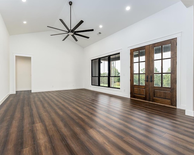 unfurnished living room with dark hardwood / wood-style flooring, lofted ceiling, french doors, and ceiling fan