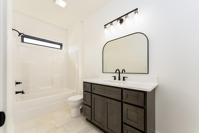 full bathroom with vanity, toilet, and  shower combination