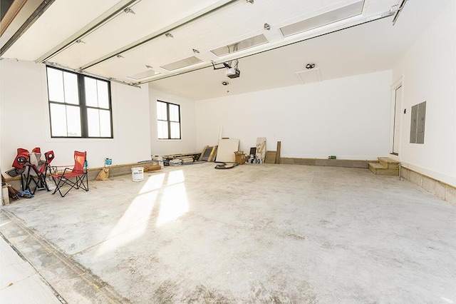 misc room featuring concrete flooring and electric panel