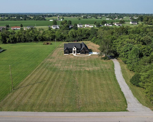 birds eye view of property with a rural view