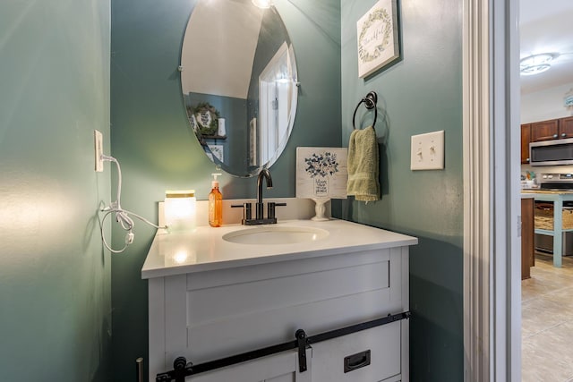 bathroom featuring tile patterned flooring and vanity