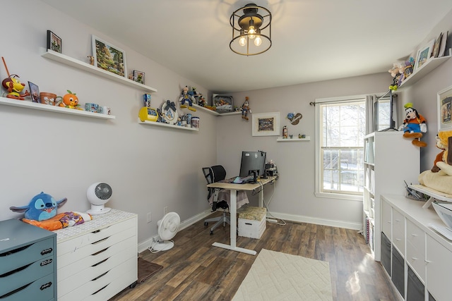 home office with dark wood-style floors and baseboards