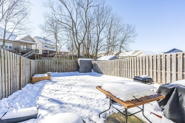 view of yard layered in snow