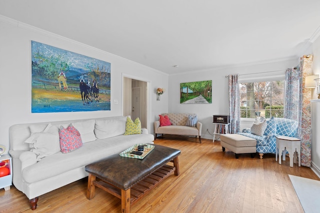 living room with hardwood / wood-style flooring and ornamental molding