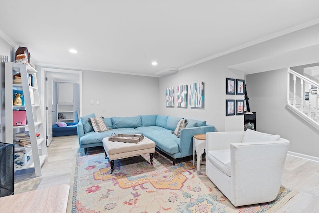 living room with crown molding and light wood-type flooring