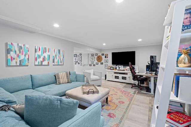 living room with crown molding and light hardwood / wood-style flooring