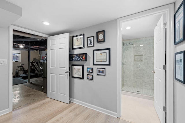 hall with light hardwood / wood-style flooring