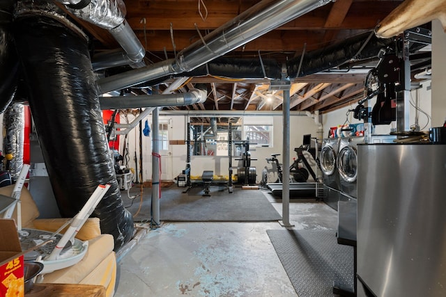 workout area with washing machine and dryer