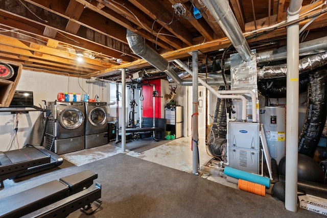 basement featuring water heater and independent washer and dryer