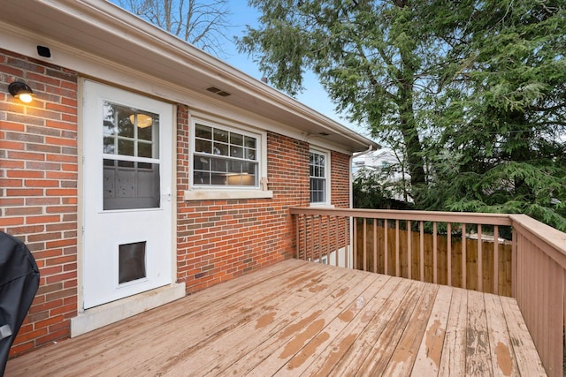 wooden deck with area for grilling