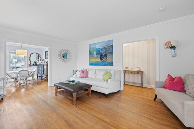 living room featuring hardwood / wood-style flooring and ornamental molding