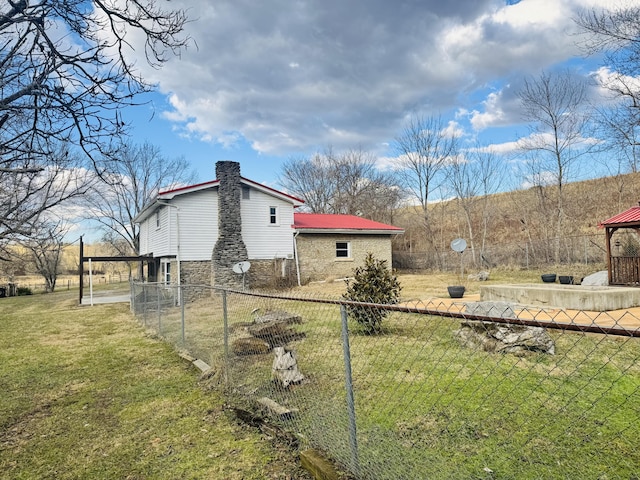 view of home's exterior with a yard