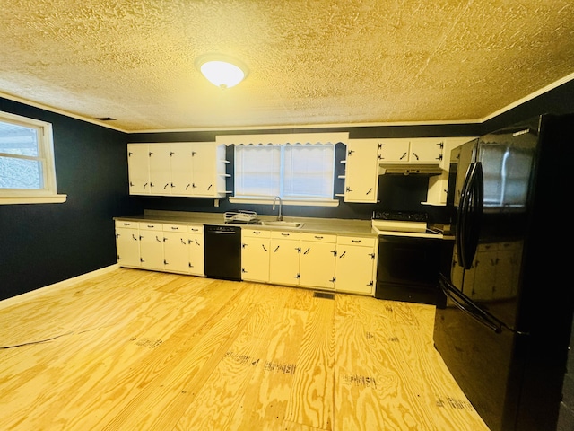 kitchen with sink, black appliances, a textured ceiling, light wood-type flooring, and white cabinets