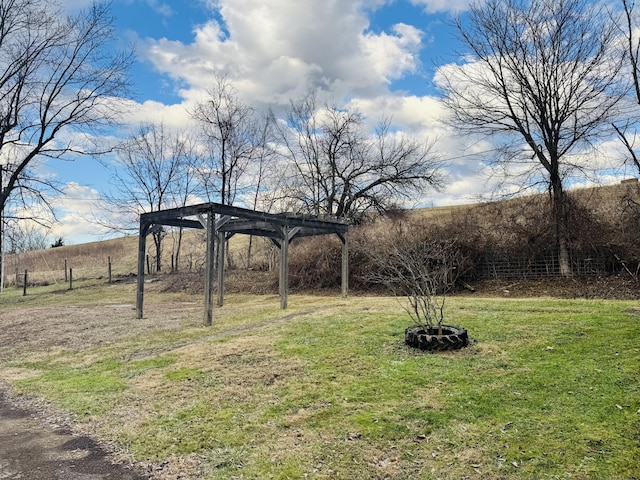 view of yard with a rural view