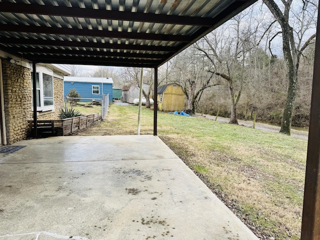 view of patio / terrace featuring a storage shed