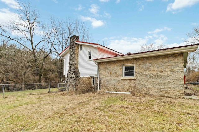 view of home's exterior featuring a yard