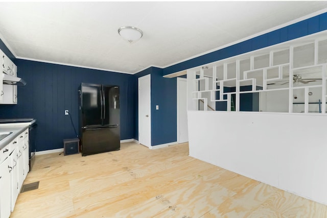 kitchen featuring black refrigerator, ceiling fan, white cabinets, and light wood-type flooring