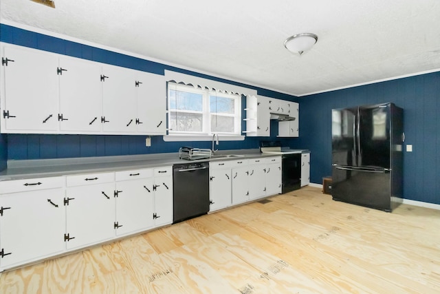 kitchen featuring sink, white cabinets, light hardwood / wood-style floors, and black appliances