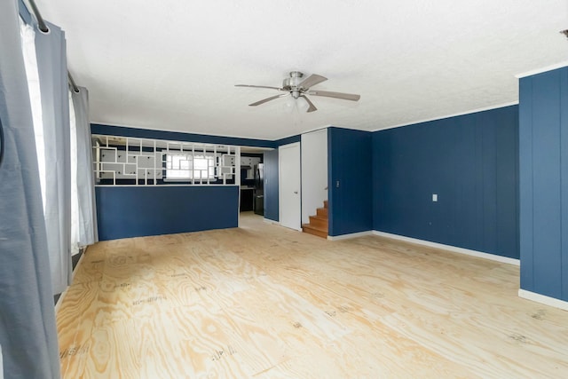 spare room with ceiling fan and wood-type flooring