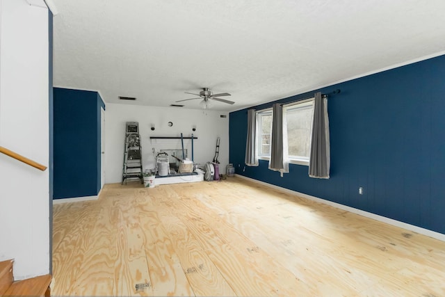 spare room featuring hardwood / wood-style floors, a textured ceiling, and ceiling fan