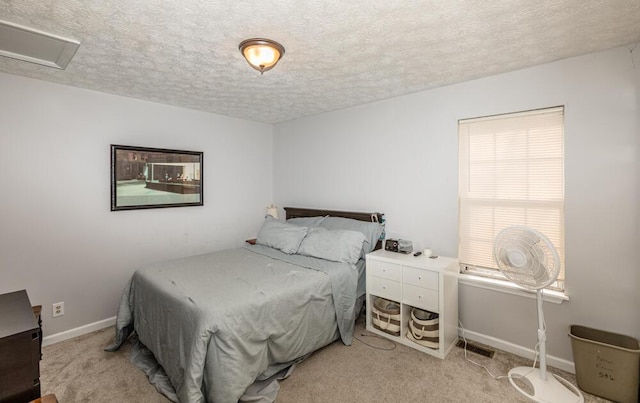 carpeted bedroom featuring a textured ceiling