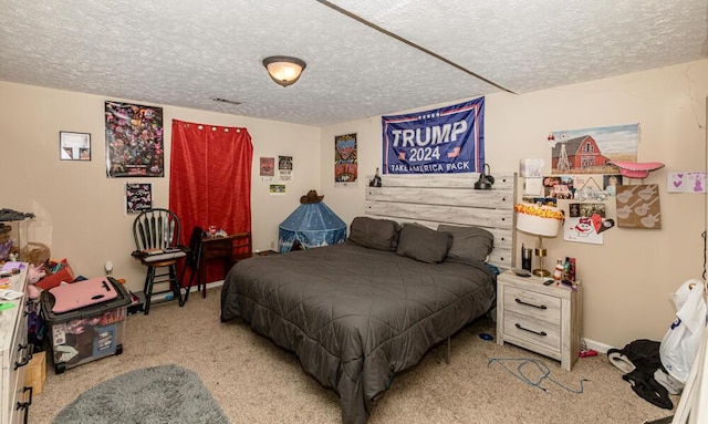 carpeted bedroom with a textured ceiling