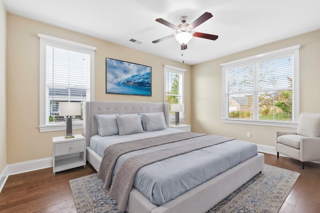 bedroom featuring dark hardwood / wood-style floors and ceiling fan