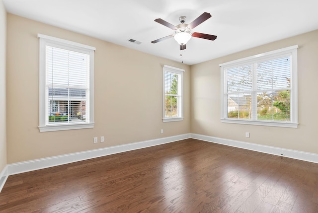 unfurnished room featuring dark hardwood / wood-style flooring and ceiling fan