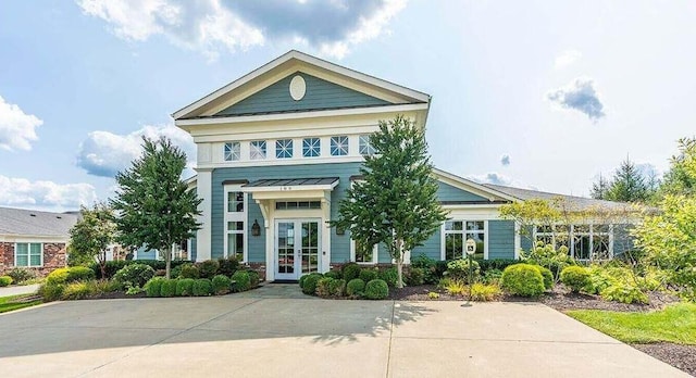 greek revival inspired property featuring french doors