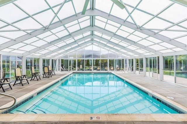 view of swimming pool featuring a lanai