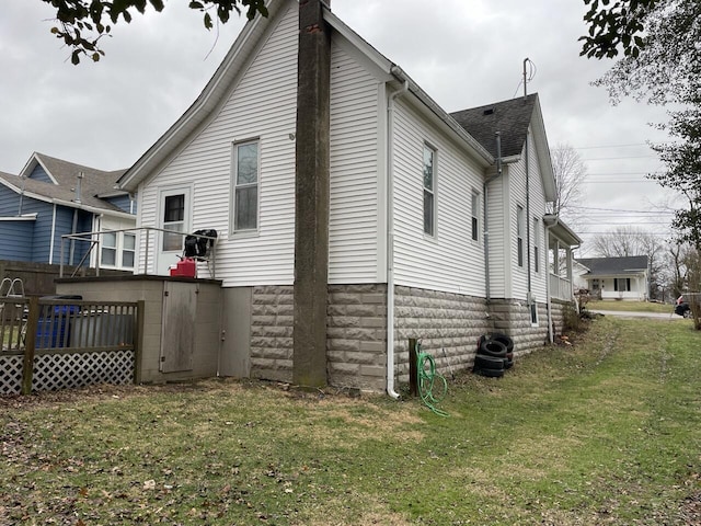 view of home's exterior featuring a lawn